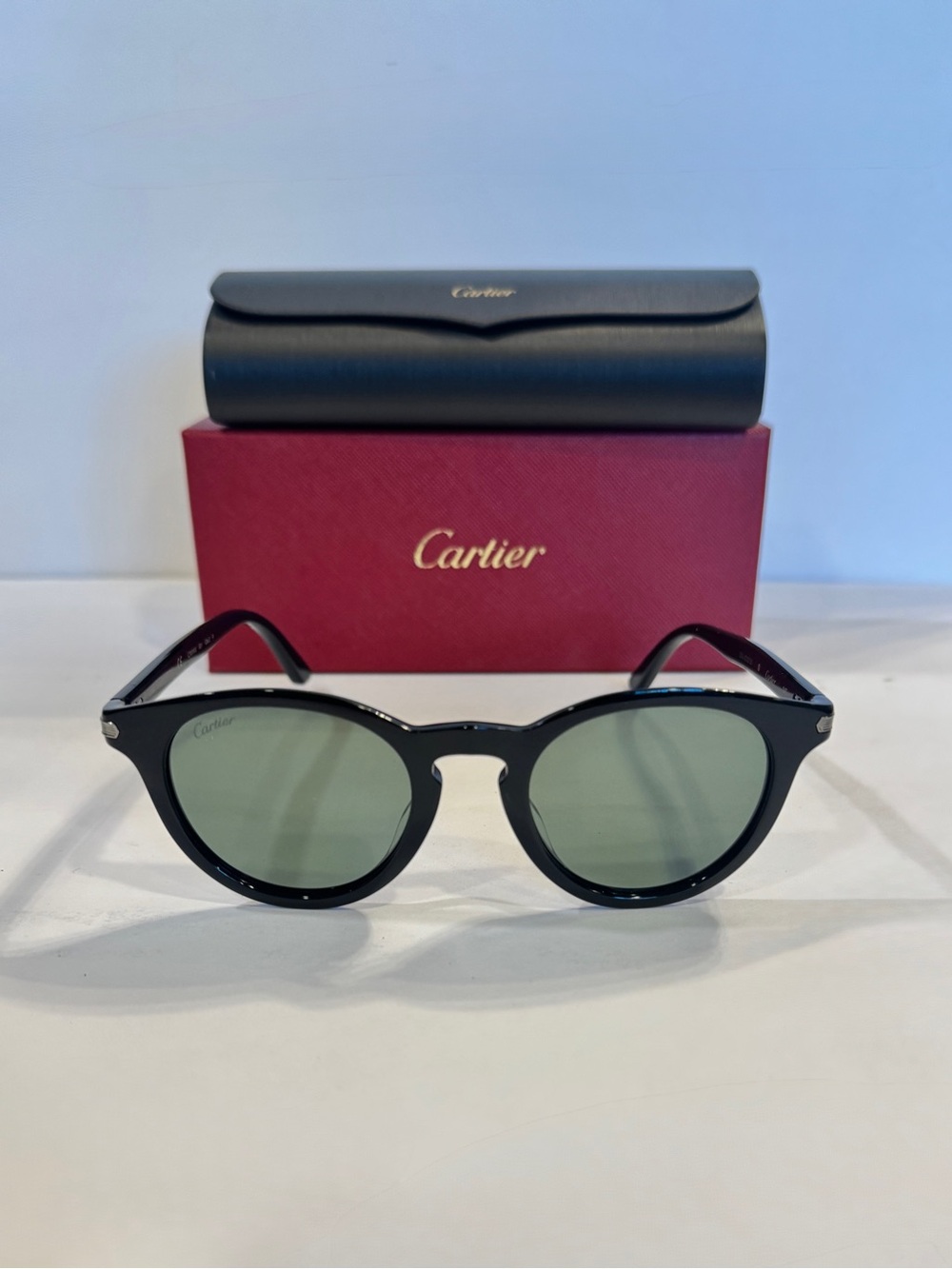 Cartier Black Frame Sunglasses with Green Lenses